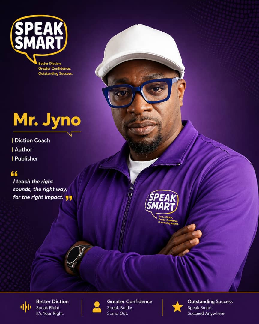 Formal Black Nigerian male teacher standing in a neutral classroom background